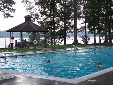 Community olympic size pool with diving board, seats, clubhouse, showers, bathrooms, picnic tables and charcoal grills for your use during your stay