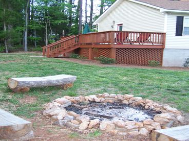 Rear deck and fire pit area of the yard area.