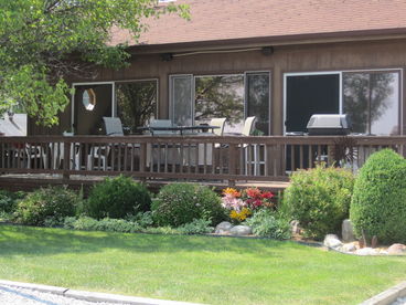The deck is spacious and offers seating at the bar and dining table along with use of the grill (propane provided).  Outdoor speakers provide music for entertainment.