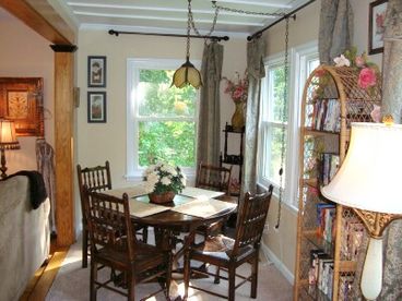 Just off the living room is the sunny dining area.  Not shown is the fabulous massage chair that sits beside the lamp in the foreground.