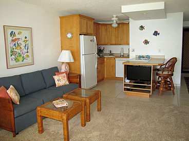 Complete kitchen with range, oven, refrigerator with icemaker, dishwasher.