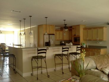 Open to kitchen, dining and living areas 