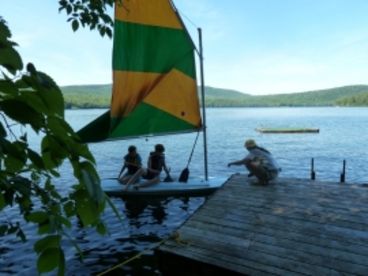 Dock, raft and sailboat in use