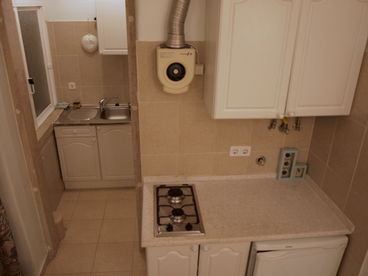 Constant hot water gas heater and extractor fan. 