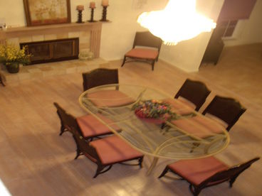 This lovely fireplace dining area is warm and inviting for table service for 8.