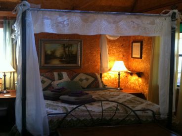 Comfortable queen canopy bed, in addition to two singles in the loft