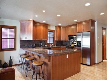 View from Living Room into Kitchen with Snack Bar Seating for 4