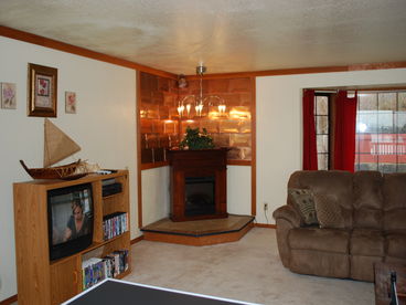 Living room with electric fireplace.