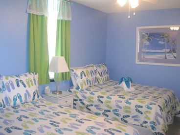 Cute guest bedroom with 2 ful size beds and 27 inch LCD