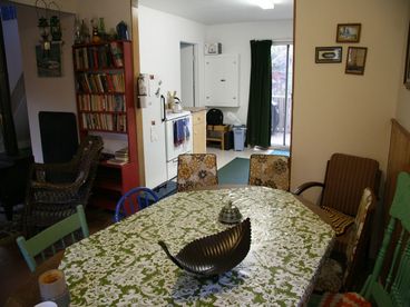 The dining room is between the kitchen and living room.