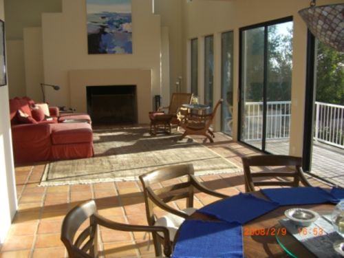 Great Room from dining area. Large wood burning fireplace.