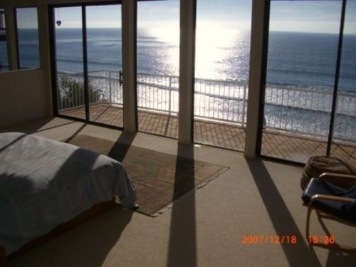 Master King bedroom with balcony overlooking ocean.