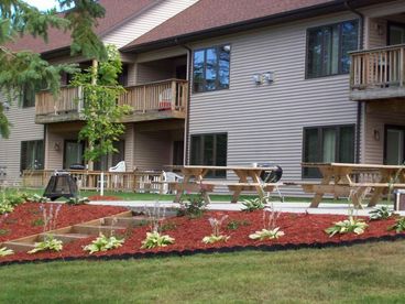 One of our two waterfront gathering patios, outfitted with picnic tables, barbeque grills and bonfire cages - the perfect place to gather for morning coffee or sunset cocktails!