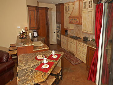 Custom kitchen fit for a gourmet, fully equipped and with premier stainless appliances.