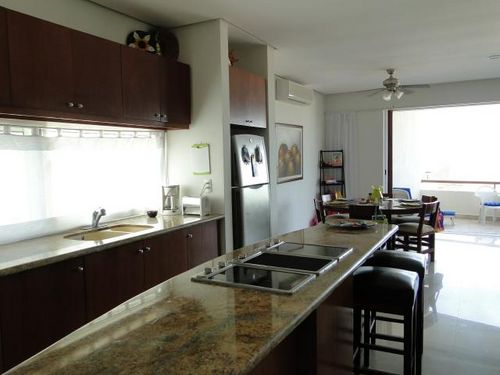 Full kitchen with island, cook top and stove
