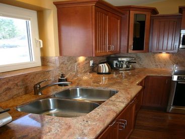 Kitchen with granite counter tops and stainless steel appliances