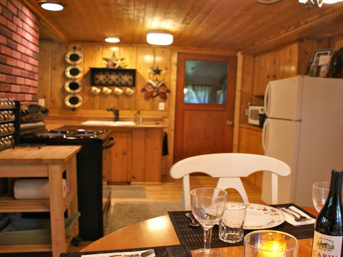 Full kitchen with gas BBQ under covered porch. 