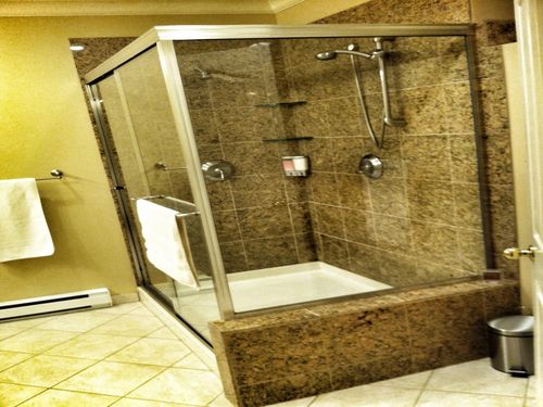 Large granite shower with heated tile floors.