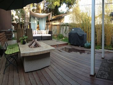 500 sf deck w/ fire pit & LED TV. Great for BBQs and lounging.