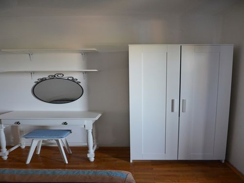 with matrimonial bed. The bedroom has an exit to a large terrace overlooking the garden/sea. 