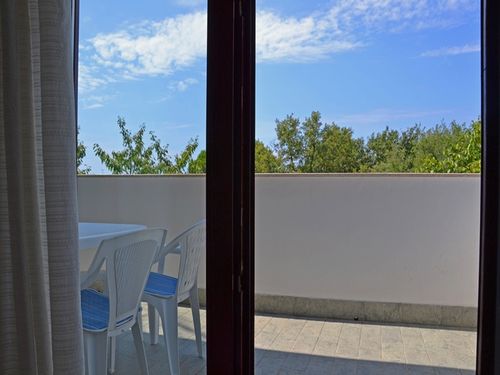 The bedroom has an exit to a large terrace overlooking the garden/sea. 
