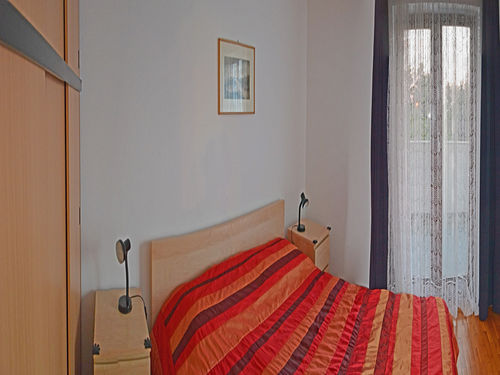 with matrimonial bed. The bedroom has an exit to a large terrace overlooking the garden/sea. 