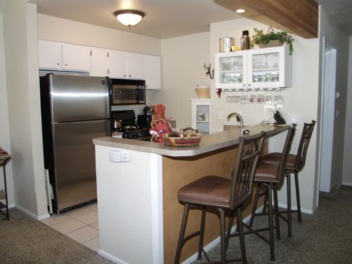Fully Equipped Gourmet Kitchen with Stainless Steel Appliances Snack Bar Seating for 3