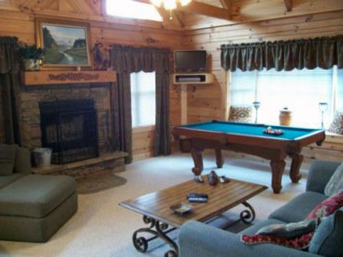The Entire Family Can Play or Relax in Our Great Room with Wood Burning Fireplace.