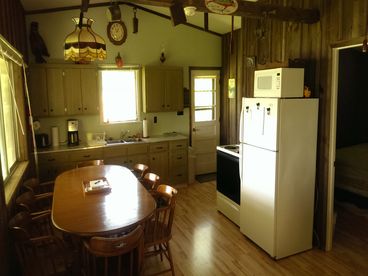 View of full furnished Kitchen / Dining area. Seating for six.