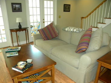 Den has plenty of seating for Guests; french doors lead to screened-in porch; ceiling fan; WiFi.