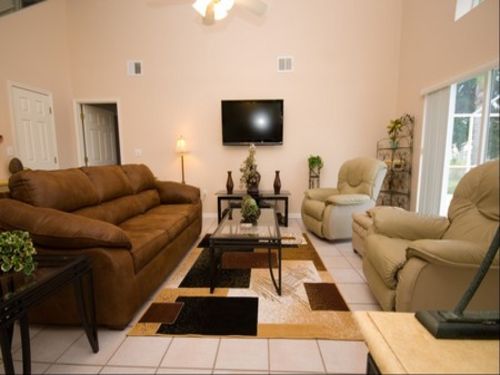 FAMILY ROOM
This large room with cathedral ceilings has superb views over the pool area and lake.
                    The furniture consists of 2 extremely comfortable Lazy Boy Recliners and a very comfortable three seater Queen Sofa bed.
                                                   TV is a large 46inch LCD with DVD/CD player and tuner 2 satellite receivers 1 American DIRECTV and the other Canadian Bell. Between the two of them thats over 800 TV and music channels to choose from. 
