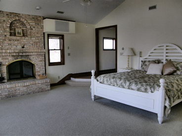 Enormous master bedroom with views to the lake that will take your breath away!