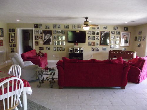 Nice large family room/kitchen dining combo, floor to ceiling windows overlooking pool patio and lake