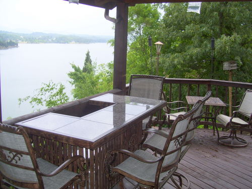 Nice large deck for entertaining, plenty of porch furniture for watching the alke activities, long range lake and mountain views