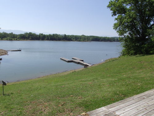 Nice large dock with boat slip, long range mountain and lake views