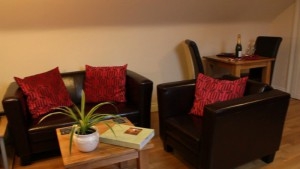 Laura\'s Loft has comfortable leather sofas in its spacious open plan living area