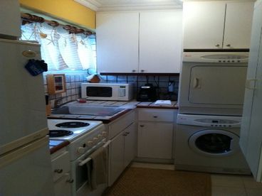 The Studio kitchen is fully equipped with pots, pans, laundry-center, microwave, refrigerator with freezer, stove with oven... feel like a big apartment!