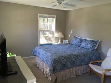 Large private master bedroom with dimmable lights and a ceiling fan - large closets and a big screen TV.  Queen pillow top.