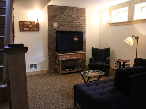 Bonus room in basement with flat screen TV.