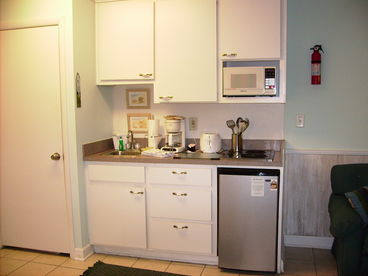 2 Burners, microwave, small refrigerator and sink