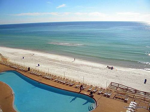 View of our 120 ft heated pool and the Gulf of Mexico and Beach from our 802 sq ft balcony