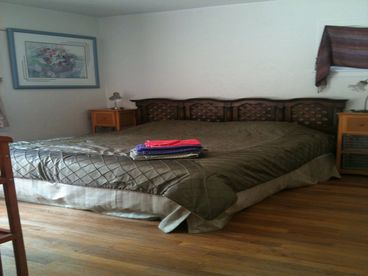 Airy, inviting master bedroom.