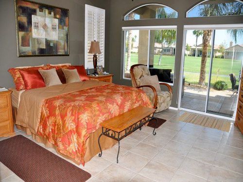 Mastbedroom with expansive views of the golf course, king bed, walk in spa shower, due sinks, granite counter tops a large walkin closet that is fully organized