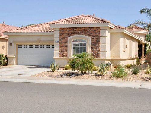 front view of home with gorgeous desert landscaping
