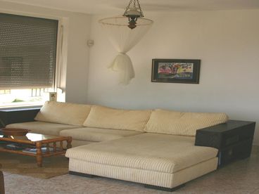 Spacious sitting and lounge areas are located on the ground floor next to the dining area.