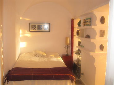 sleeping alcove, with vaulted ceiling, catching late afternoon light