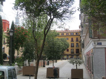 view of square from other side (apartment is in yellow building at end)