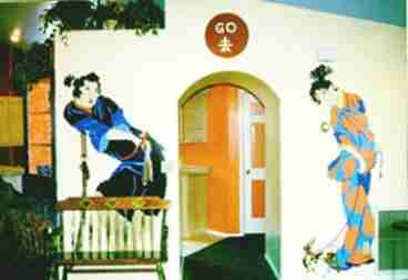 This is the first view one sees when entering the cottage. The entrance way with oriental paintings leads to the kitchen and 2nd private bedroom and bath.