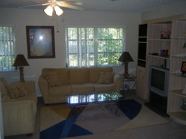 Light and Airy Family Room, Large TV, Direct TV, Stereo with CD Player, DVD Player, Sofa and Love Seat.Bar Area to Kitchen, Access to Lanai and Pool / Hot Tub Area
