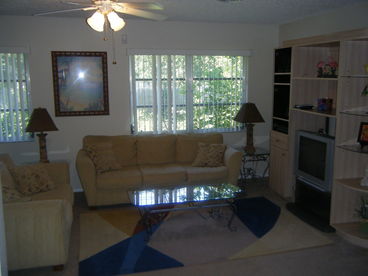 Light and Airy Family Room, Large TV, Direct TV, Stereo with CD Player, DVD Player, Sofa and Love Seat.Bar Area to Kitchen, Access to Lanai and Pool / Hot Tub Area
